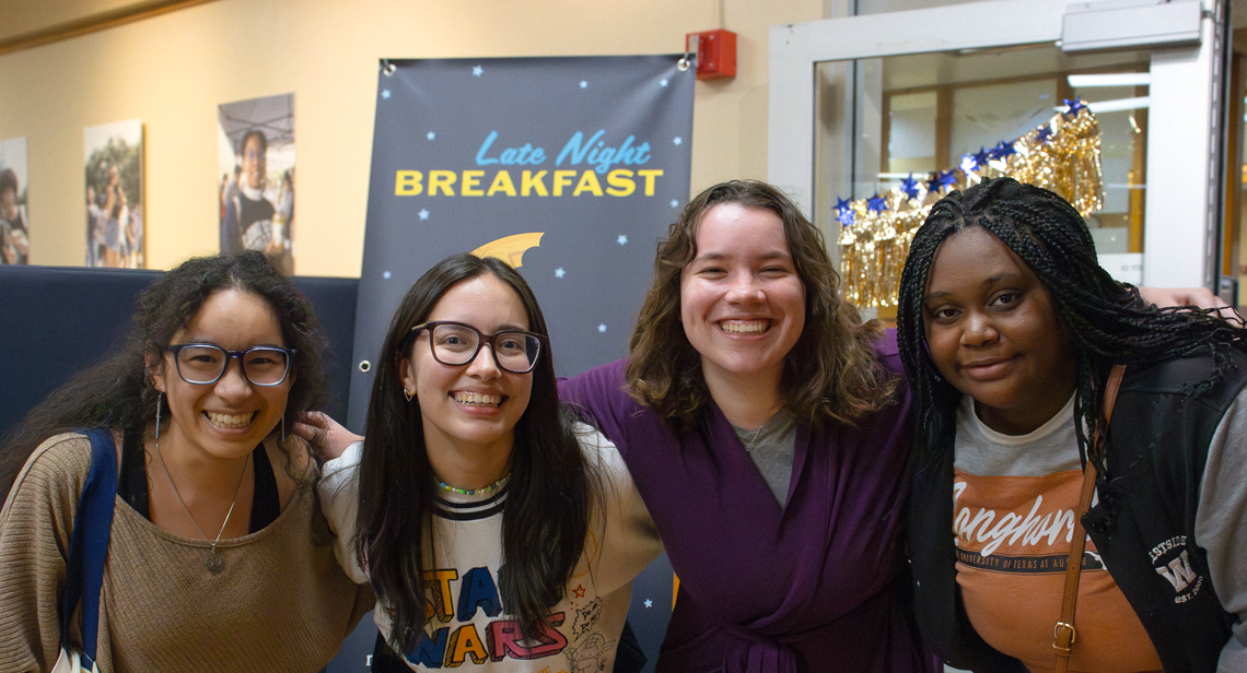 UT students pose together at the Late Night Breakfast event at Kins Dining.