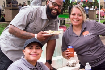 University employees enjoying food at a university housing and dining event