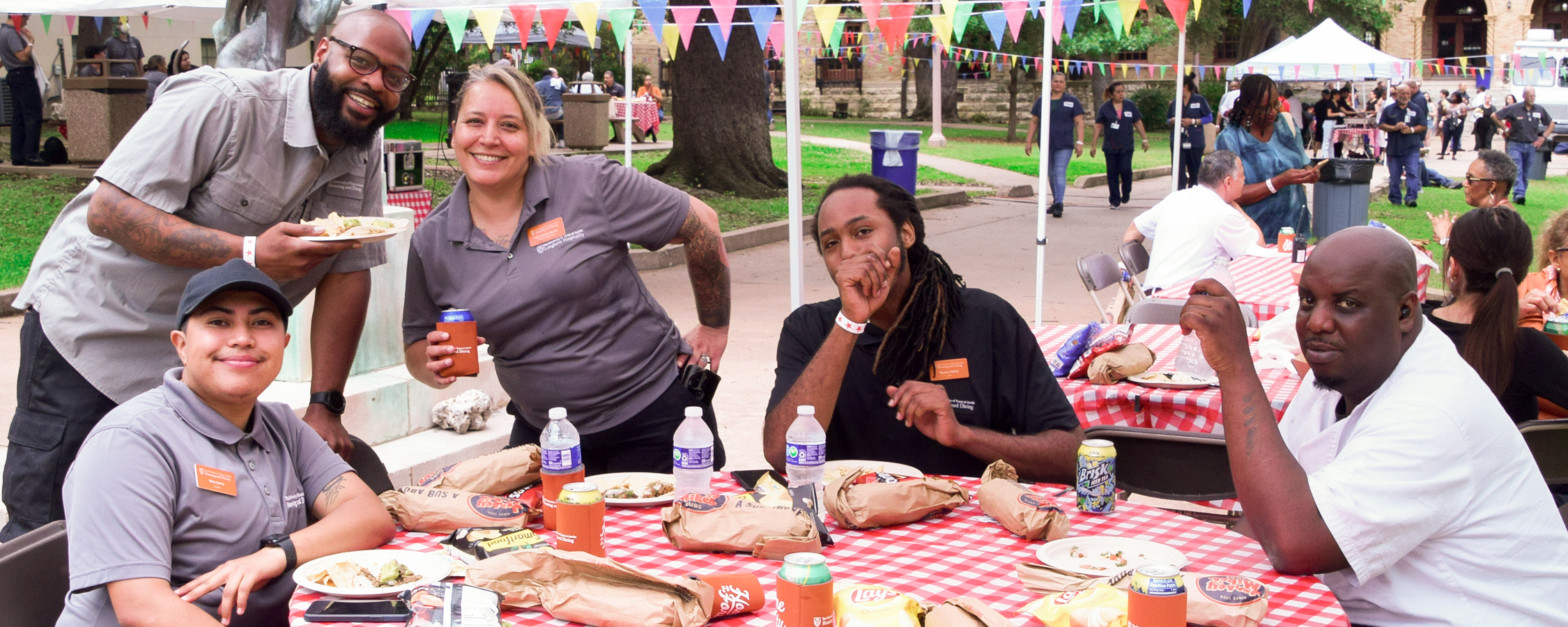 University employees enjoying food at a university housing and dining event