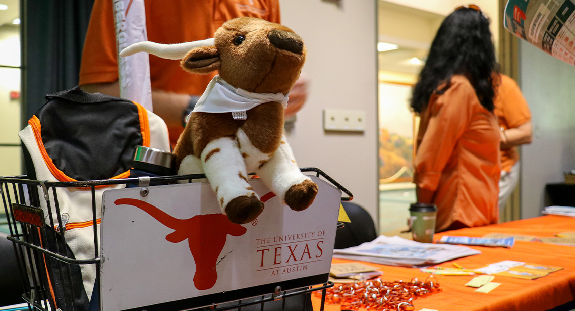 A basket of UT merch on a table.