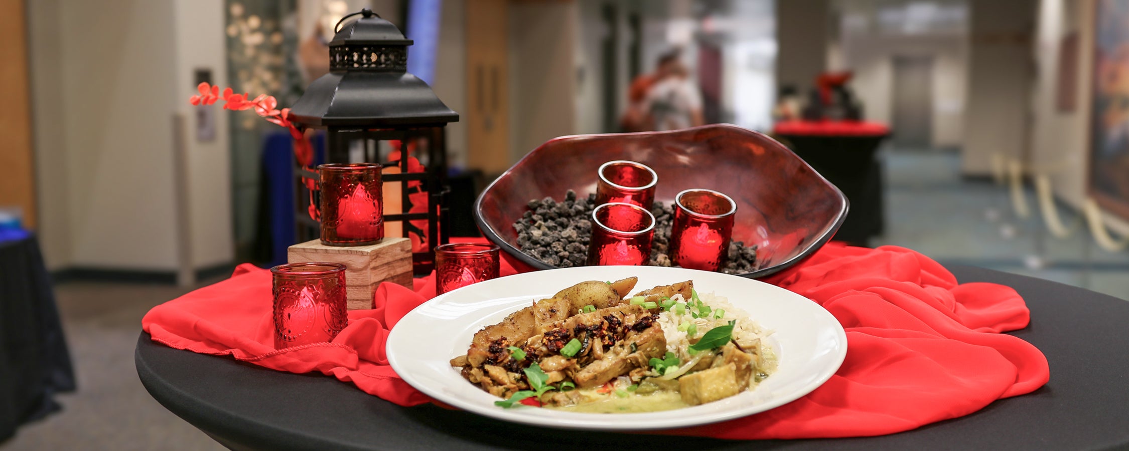 A plate of food prepared by Forty Acres Catering and decor on display at San Jacinto Hall