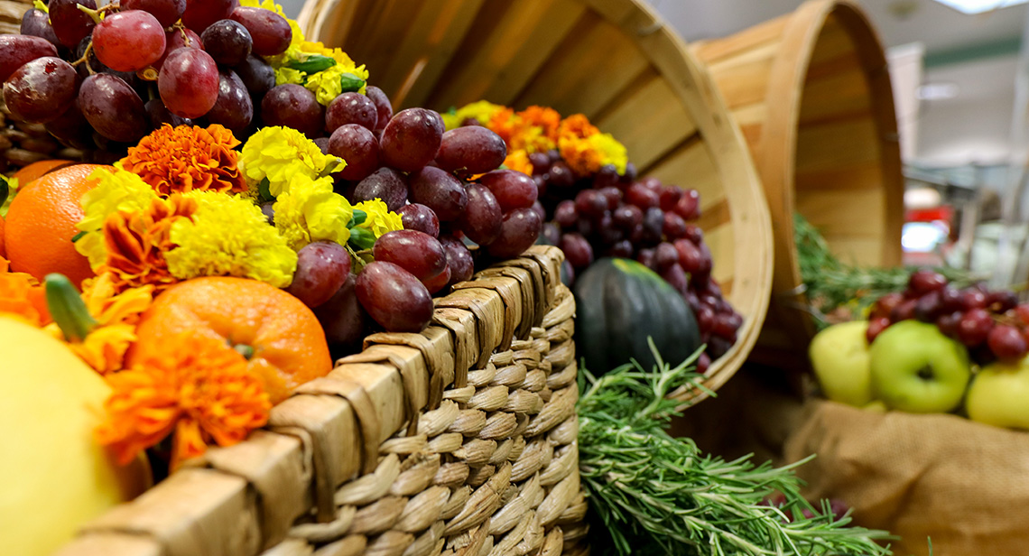 Grapes, squash and other fall produce on display in baskets