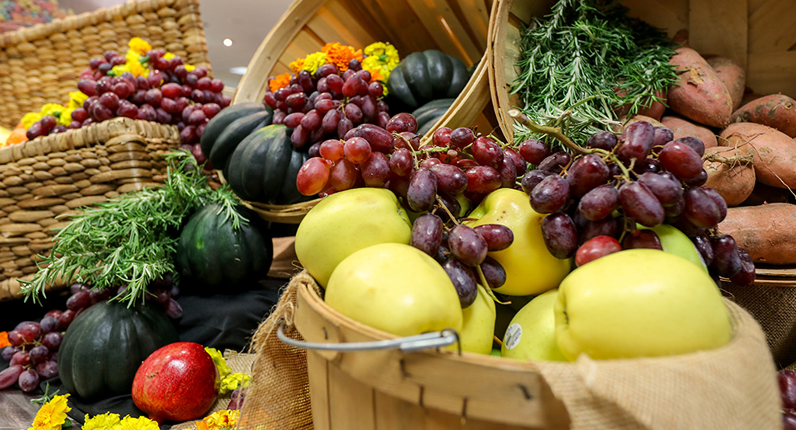 Decorative baskets of seasonal produce on display. 