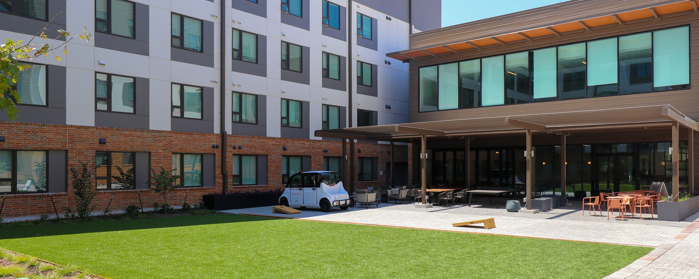 An outdoor seating area featured at the back of the Commons building at East Campus Graduate Apartments