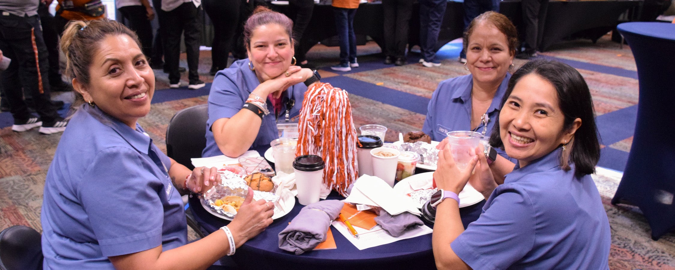 UT staff members dine at an event in the San Jacinto Multipurpose Room.