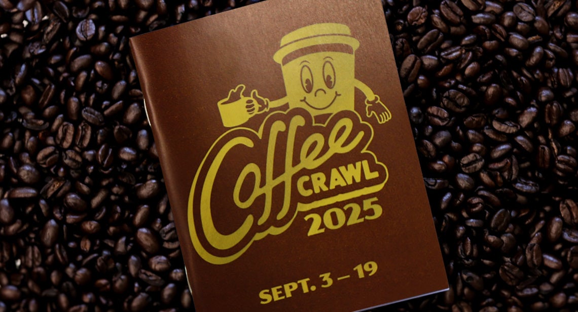 The 2025 Coffee Crawl passport surrounded by coffee beans