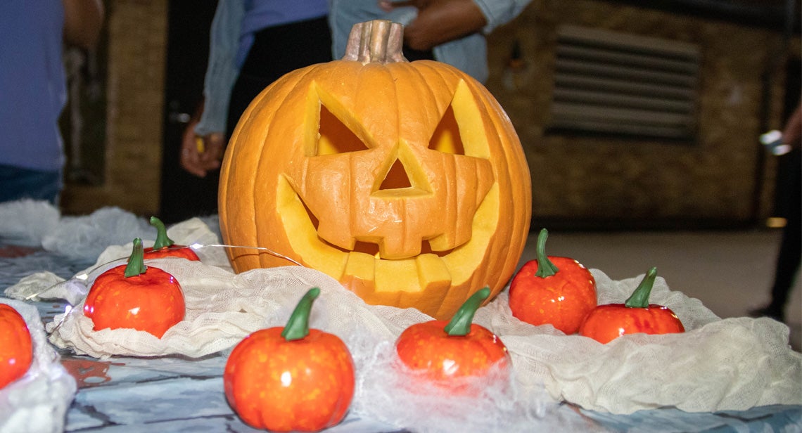 A carved pumpkin on a table