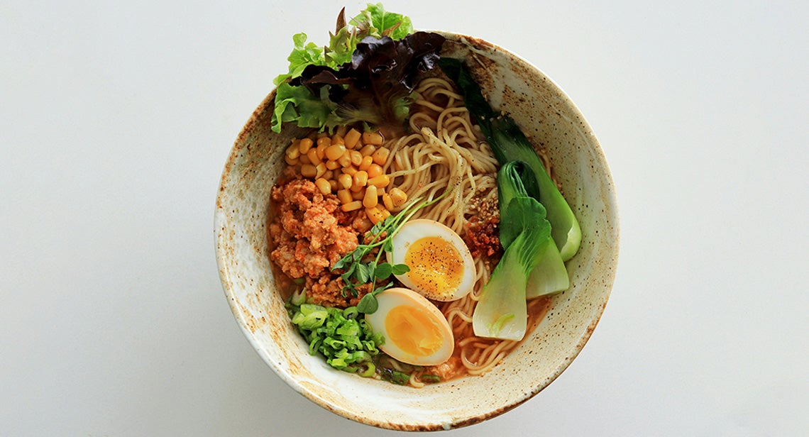 A bowl of ramen with various toppings.