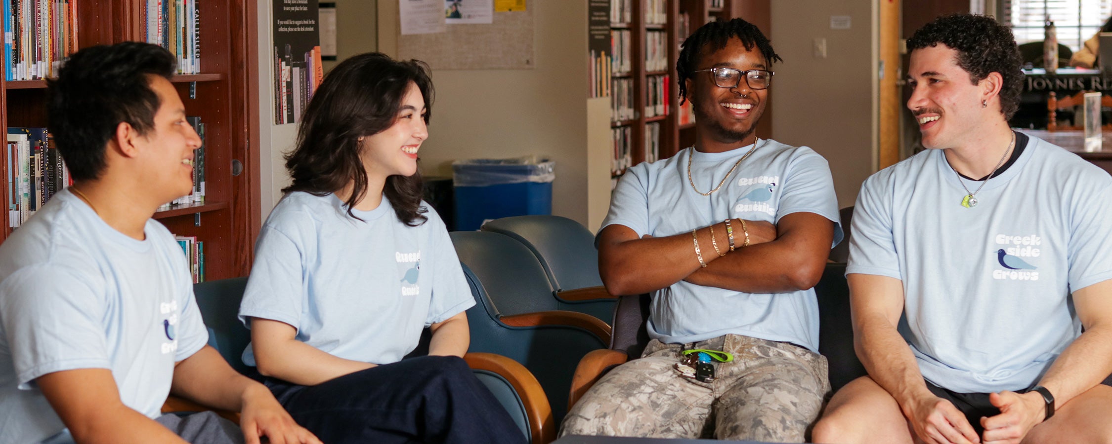 A group of UT students converse in the Joynes Reading Room