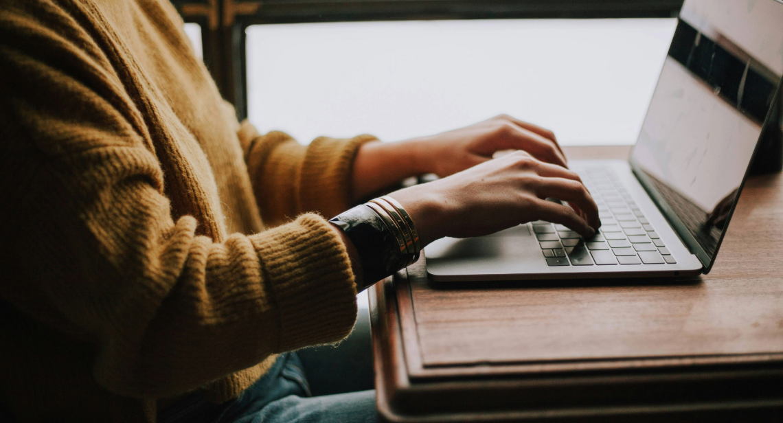 Person typing on laptop