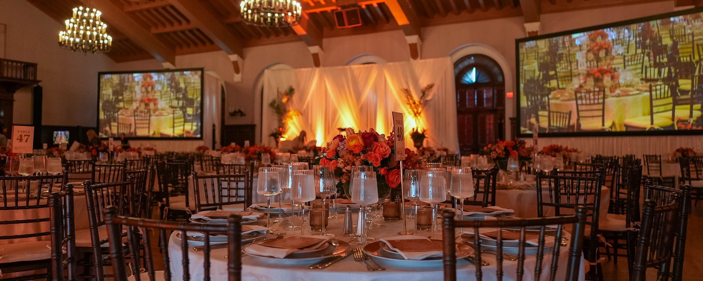 Tables set up for an event in the Shirley Bird Ballroom by Longhorn Hospitality.