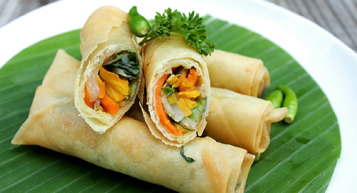 A plate of vegetable spring rolls.