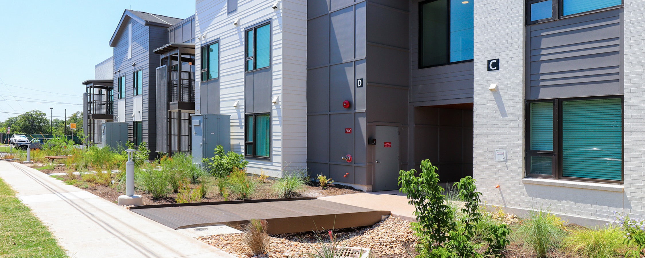 A view of East Campus Graduate Apartment’s Buildings C and D from the Leona Street view