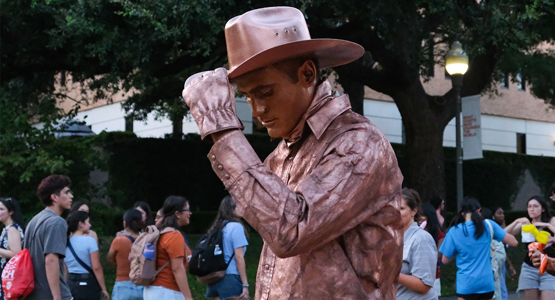A live cowboy statue at the Texas Block