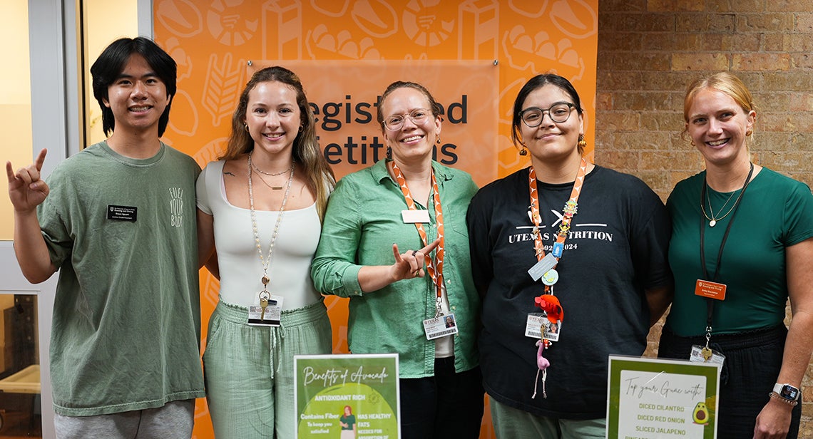 A group of UT students and UHD registered dietitians pose together at the National Guacamole Day Pop-Up event outside the UHD registered dietitians’ office. 