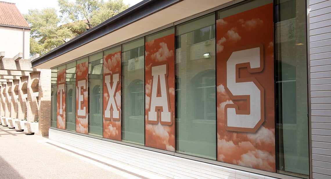 Large window graphics spelling out “Texas” on Jester East Hall