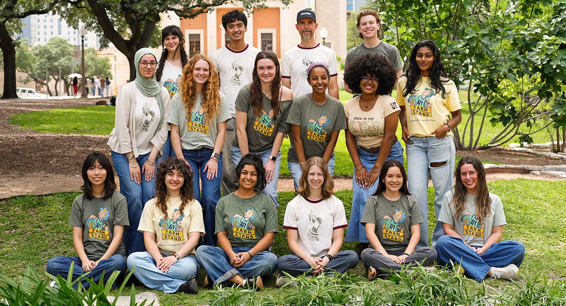 UT Farm Stand student volunteers and staff pose for a group photo while wearing UT Farm Stand shirts