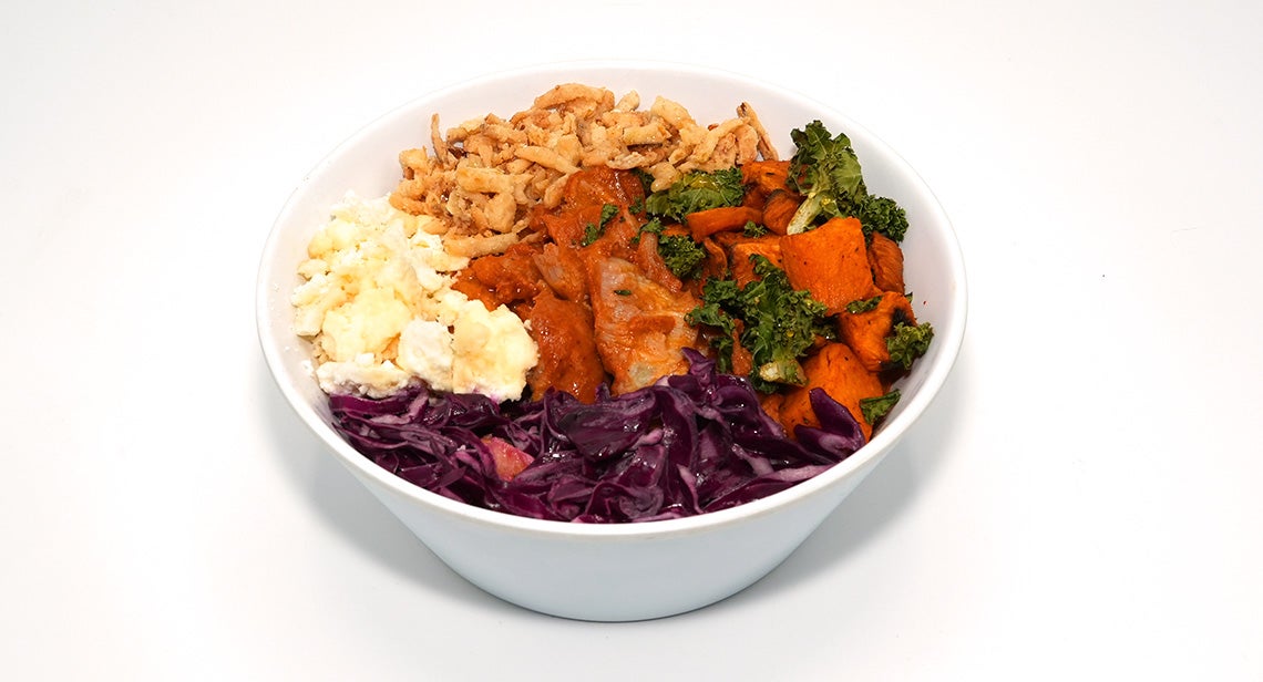 A close up of the sweet heat peach chicken bowl