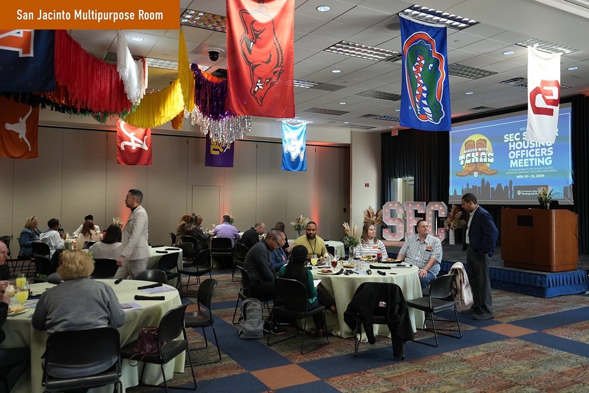 People convening at the SEC Housing Officers meeting event in the San Jacinto Multipurpose Room