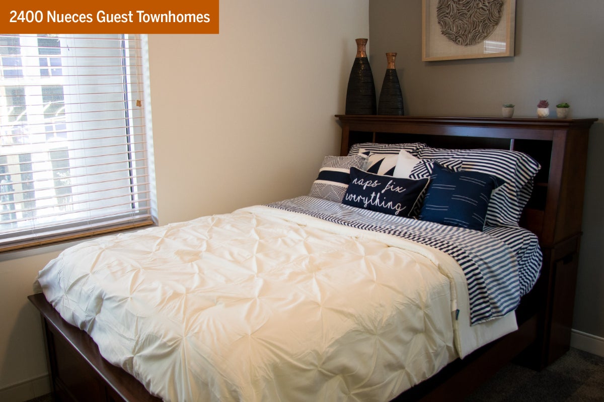 A bedroom in a 2400 Nueces Guest Townhome