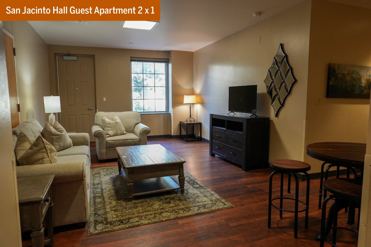 The living room in a two bedroom one bathroom San Jacinto Hall Guest Apartment