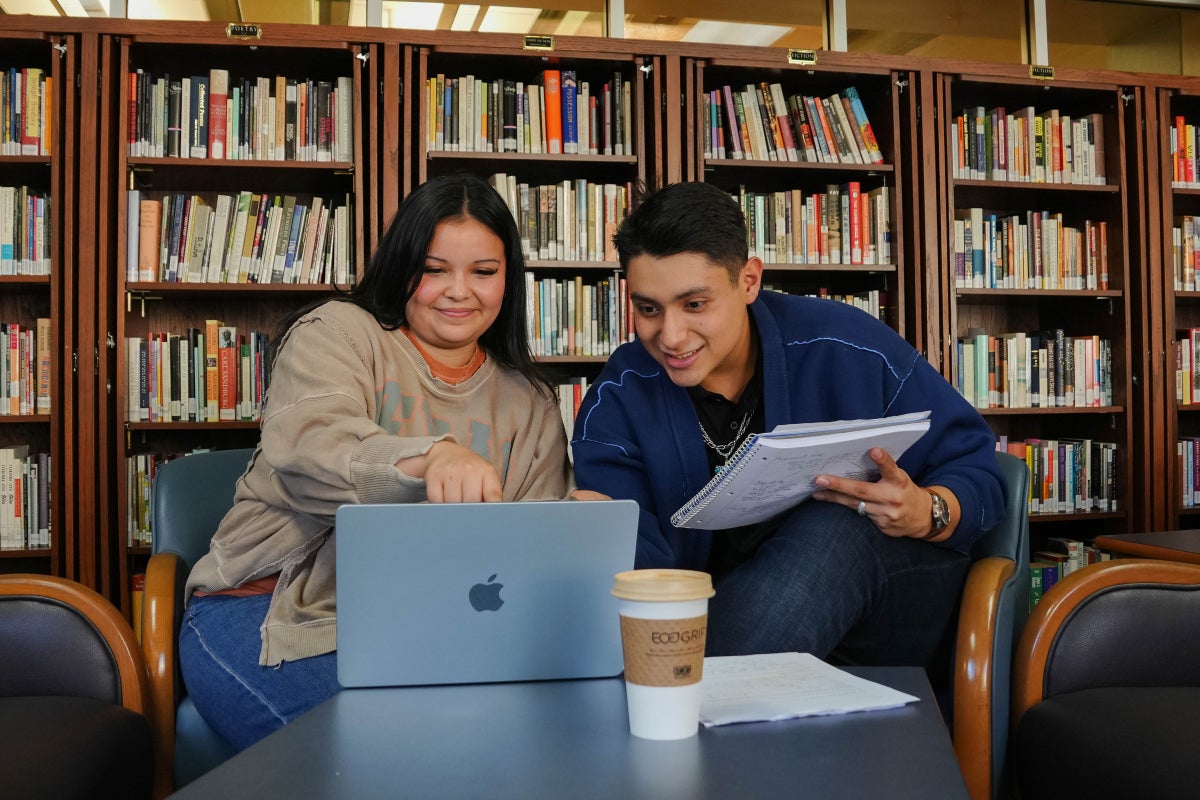 Two UT students study together in a study room in Carothers Hall. 