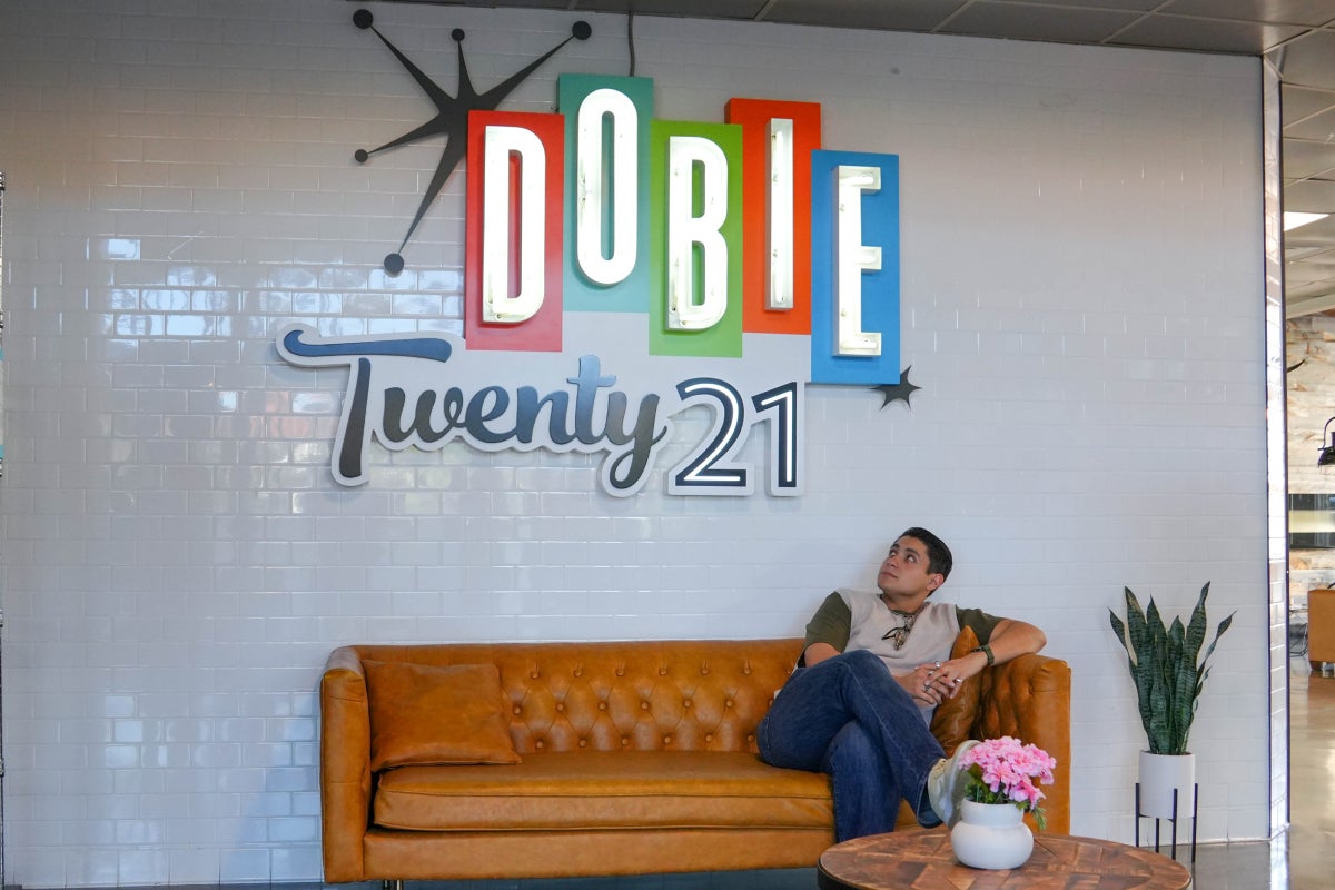 A UT student sits in the Dobie Twenty21 lobby. 