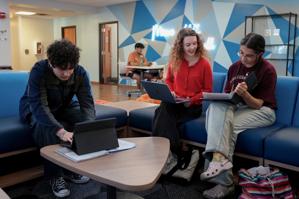 A group of UT students study in the Moore-Hill Hall lounge. 