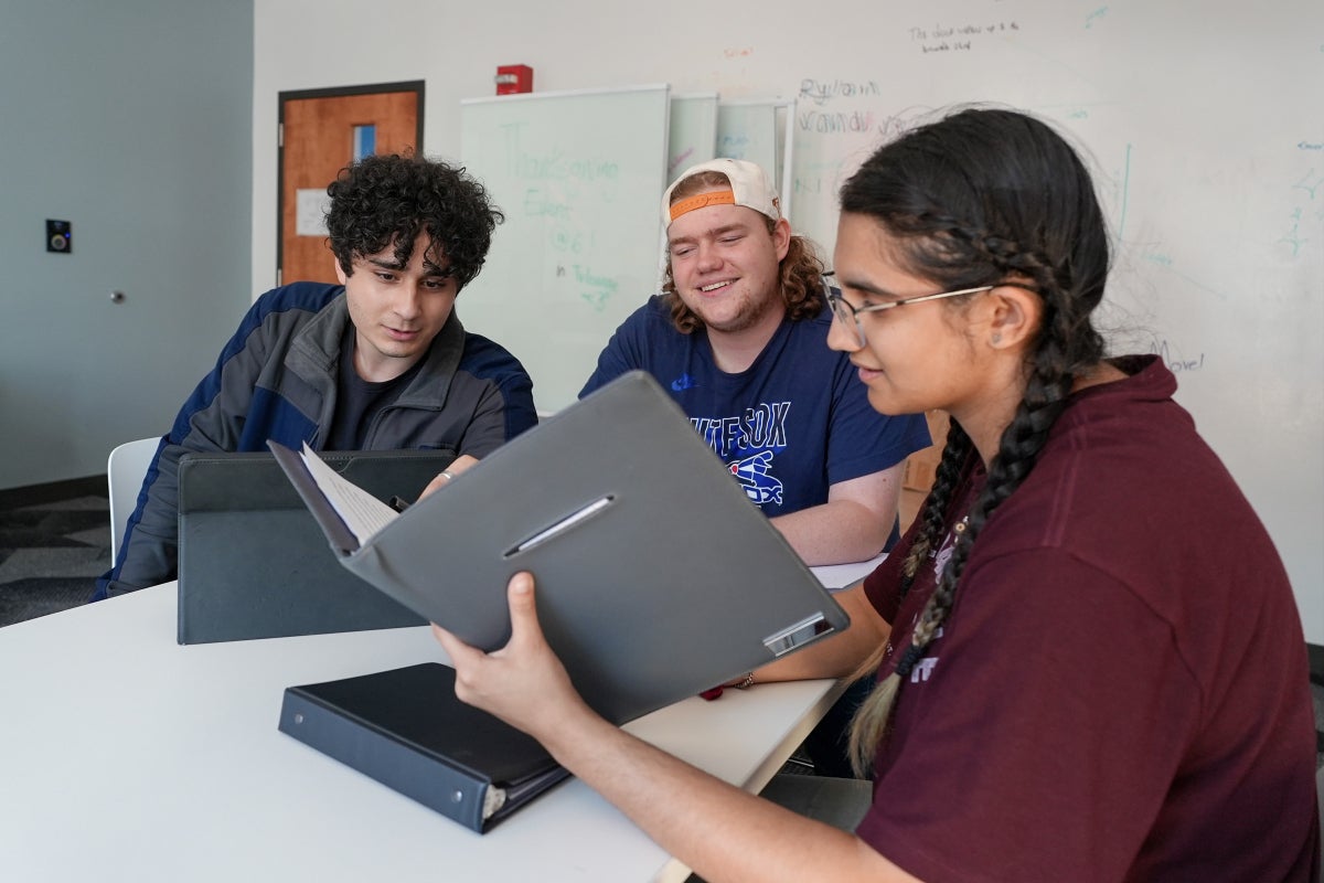 A group of UT students study in a Moore-Hill Hall study room.