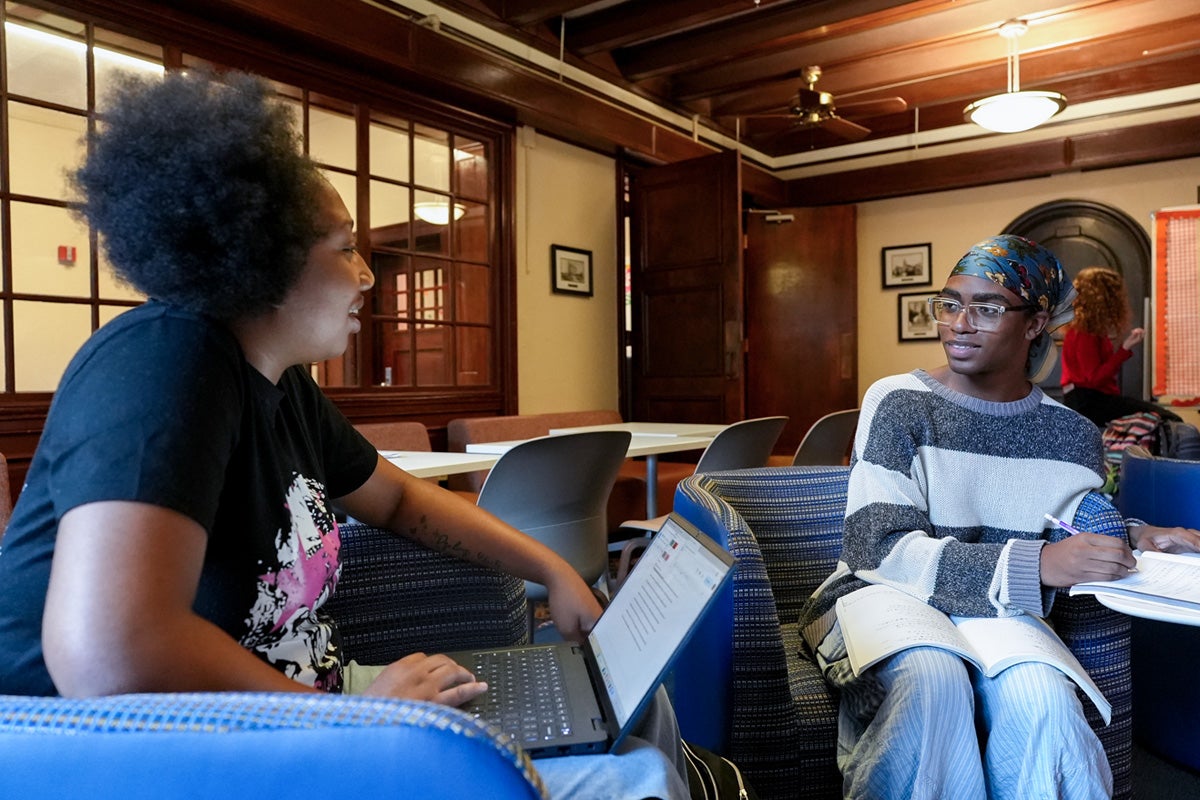 Two UT students study together in a Prather Hall study lounge