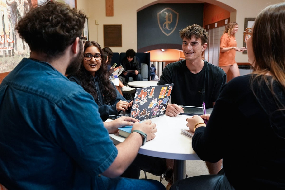 A group of UT students study together in the Prather Hall lobby