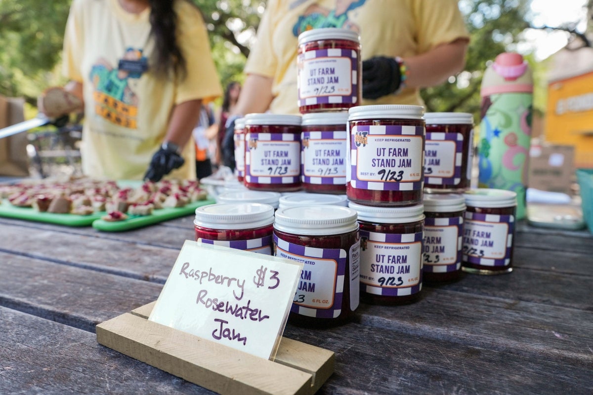A close up of Raspberry Rosewater Jam jars at a UT Farm Stand market