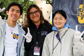 Three UT student employees at a UT Farm Stand market