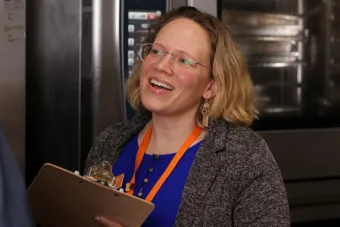 A University Housing and Dining registered dietitian and chef converse in a kitchen