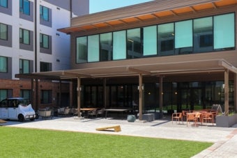 An outdoor seating area featured at the back of the Commons building at East Campus Graduate Apartments