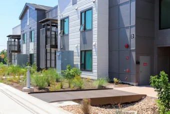 A view of Buildings C and D from the Leona Street view at East Campus Graduate Apartments.