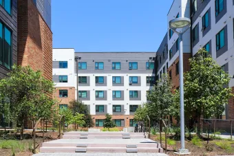 The stair and ramp entry to the courtyard section of Building A at East Campus Graduate Apartments.