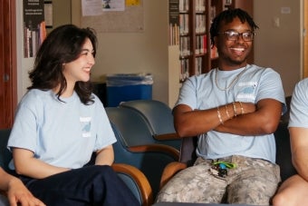 A group of UT students converse in the Joynes Reading Room