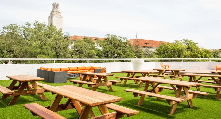 Hidden Gems - UT tower seen from Dobie rooftop with seating Hidden Gems - Dobie rooftop